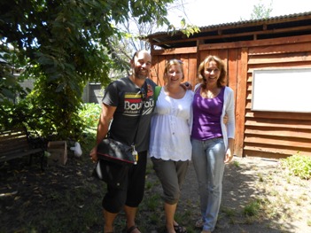 Couple of students in spanish course in front of house